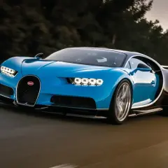 Niebieski Bugatti Chiron pędzi po drodze. Jego cena jest astronomiczna, ale wrażenia z jazdy bezcenne.
