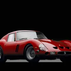 Czerwone Ferrari 250 GTO, ikona motoryzacji. Jego cena na aukcjach osiąga astronomiczne kwoty, świadcząc o legendarnym statusie.