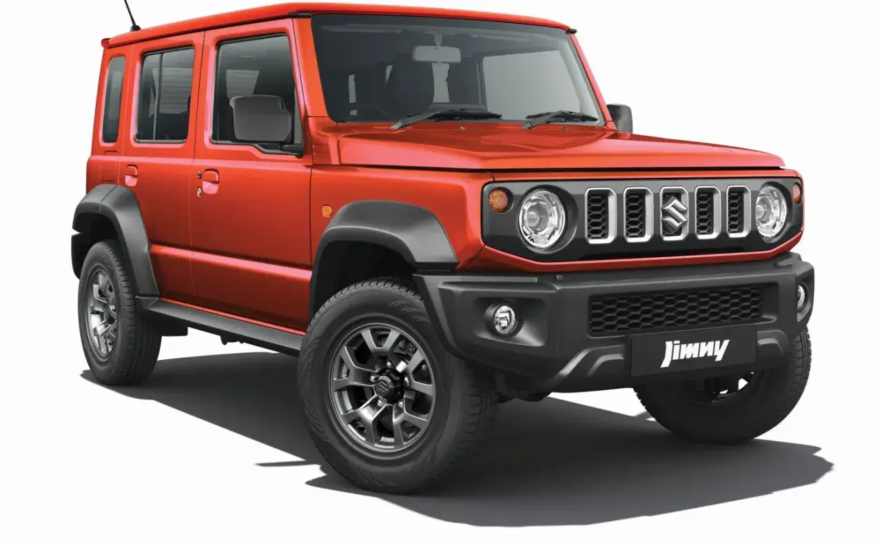Pomarańczowy Suzuki Jimny 5-drzwiowy, idealny na przygody. Sprawdź jego cenę i możliwości!